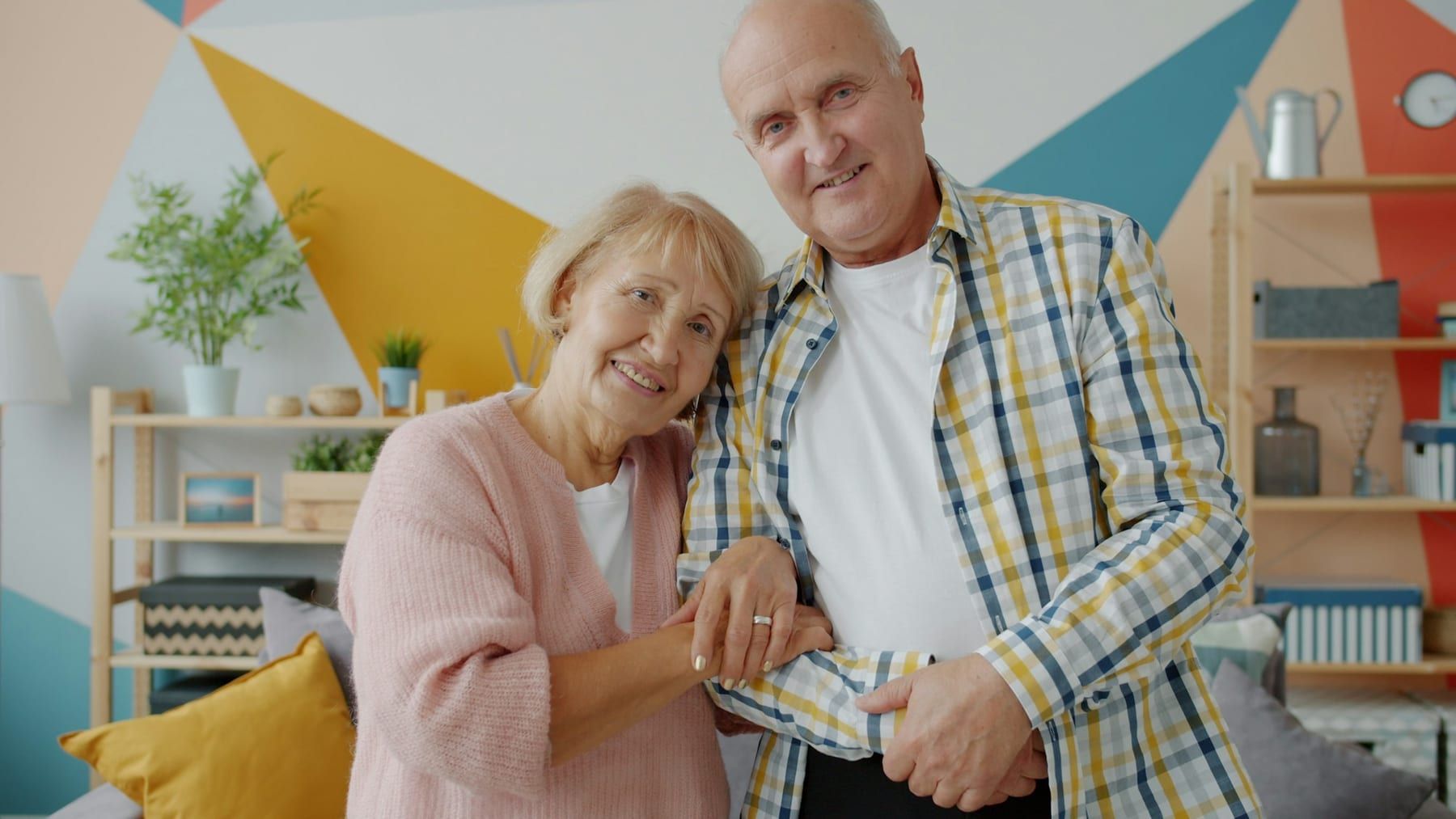 A smiling older couple at home