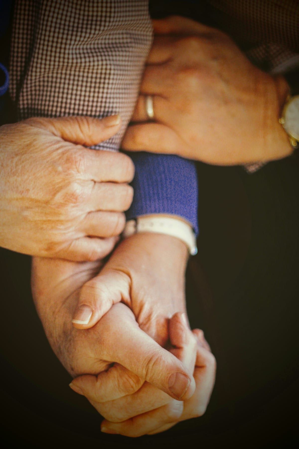 Hands of several people joined together